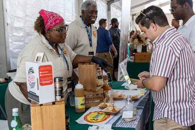 Tasting food at the Lillie's of Charleston booth