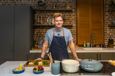 A chef standing in a kitchen